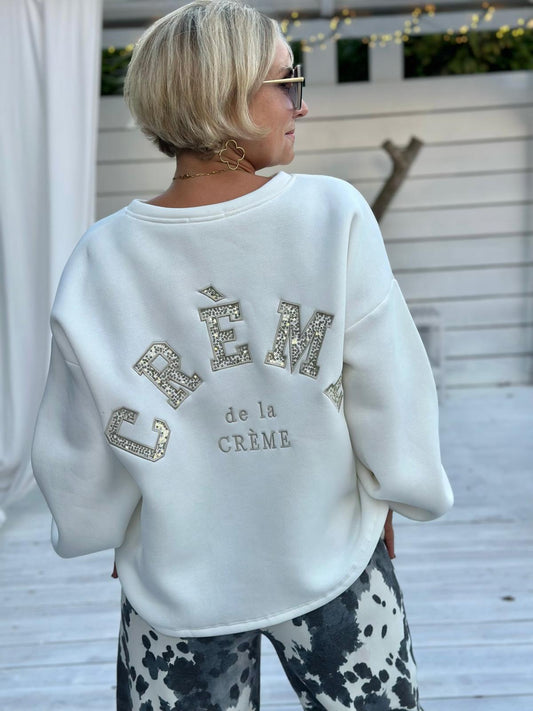 Crème de la Crème – Oversize Sweatshirt mit funkelnder Pailletten-Applikation