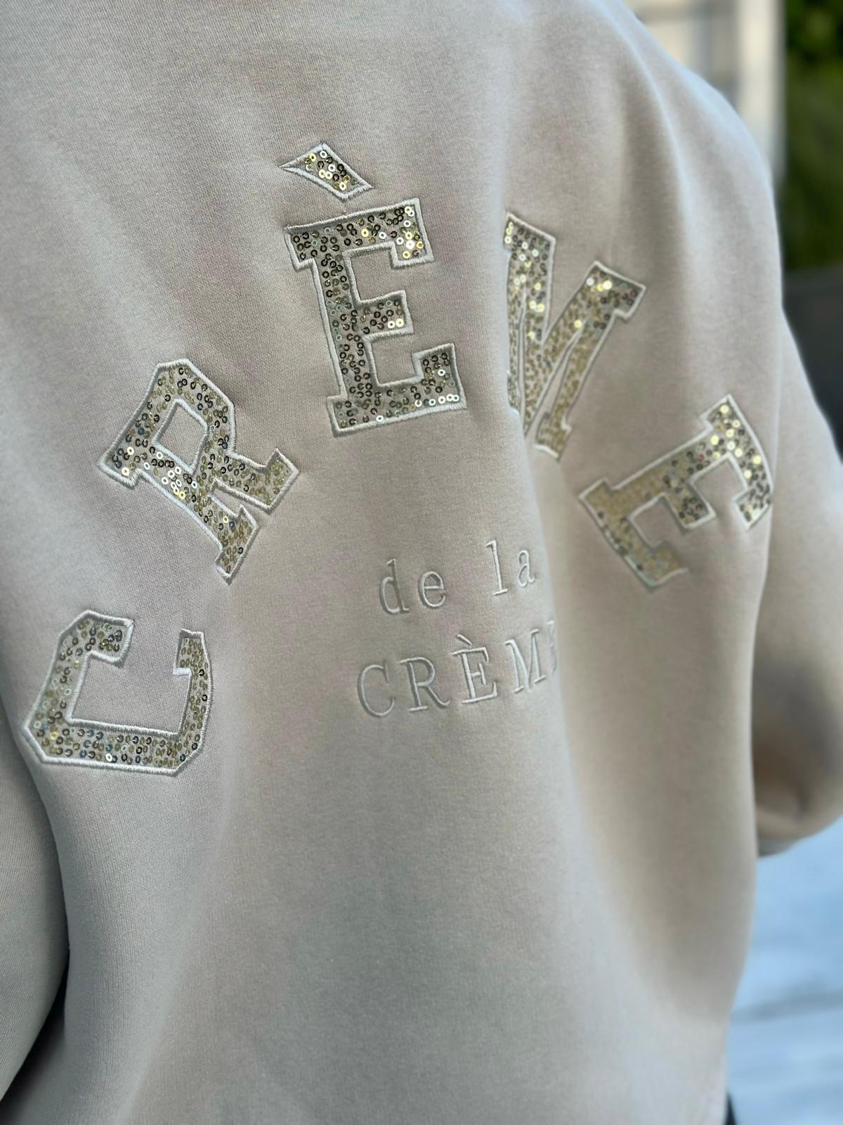 Crème de la Crème – Oversize Sweatshirt mit funkelnder Pailletten-Applikation in Taupé